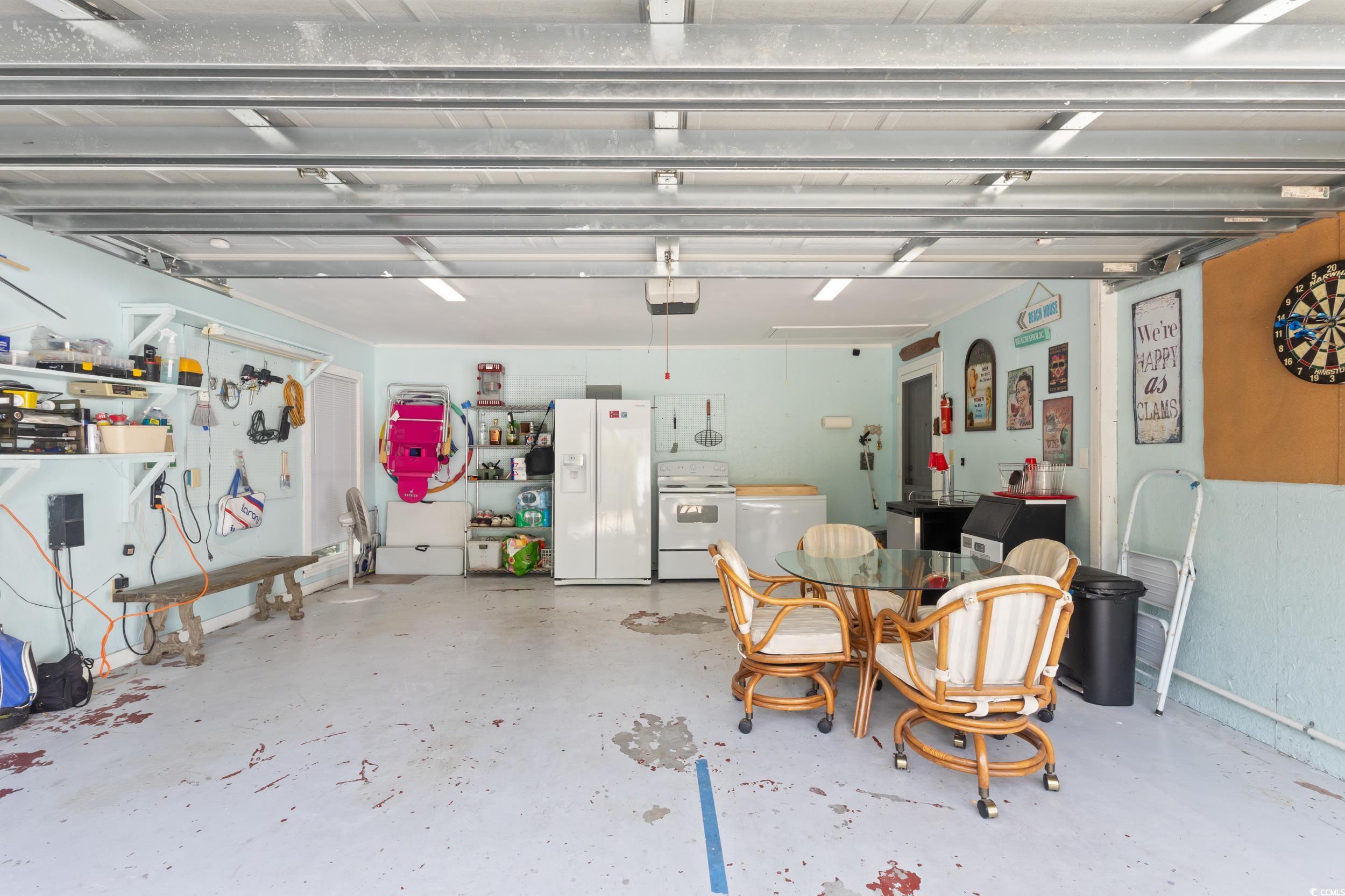 815 Tillson Road North Myrtle Beach, SC 29582 - Photo 29 of 39 Garage featuring white fridge with ice dispenser