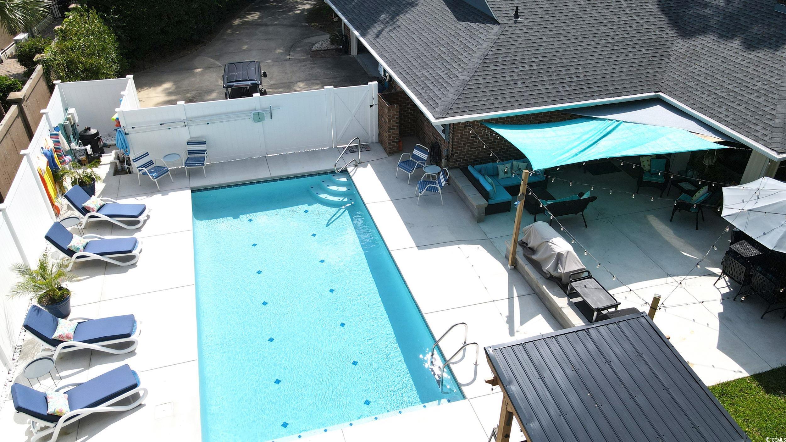 815 Tillson Road North Myrtle Beach, SC 29582 - Photo 3 of 39 View of pool featuring a fenced backyard and a patio