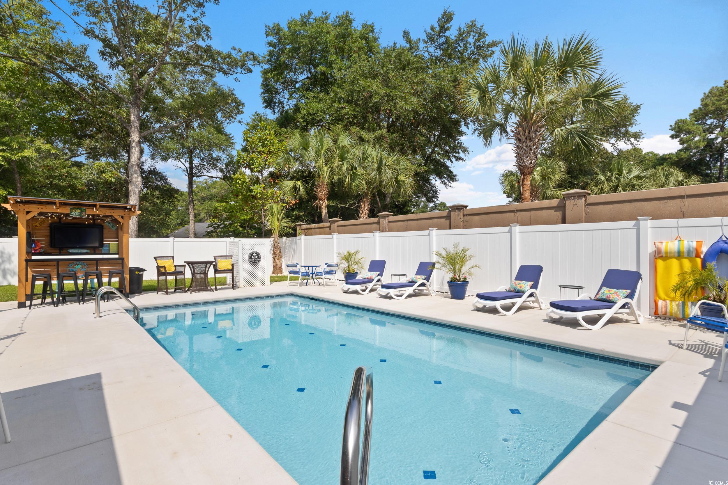 815 Tillson Road North Myrtle Beach, SC 29582 - Photo 30 of 39 View of swimming pool with a patio