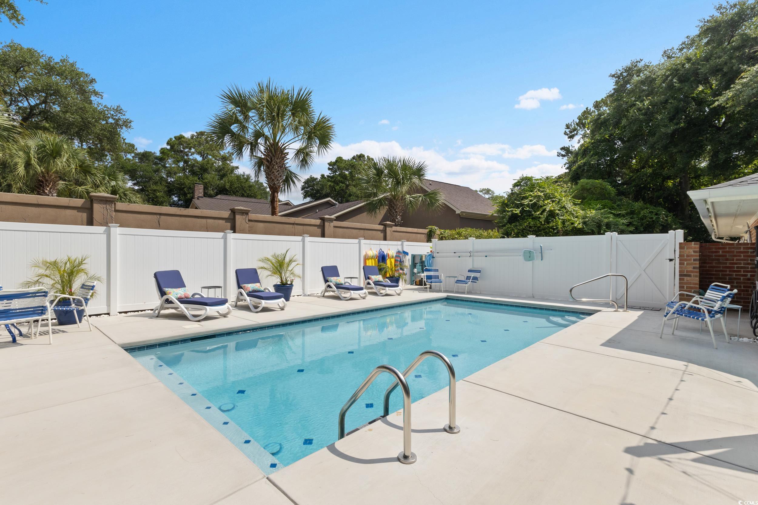815 Tillson Road North Myrtle Beach, SC 29582 - Photo 31 of 39 View of swimming pool featuring a patio and a fenced backyard