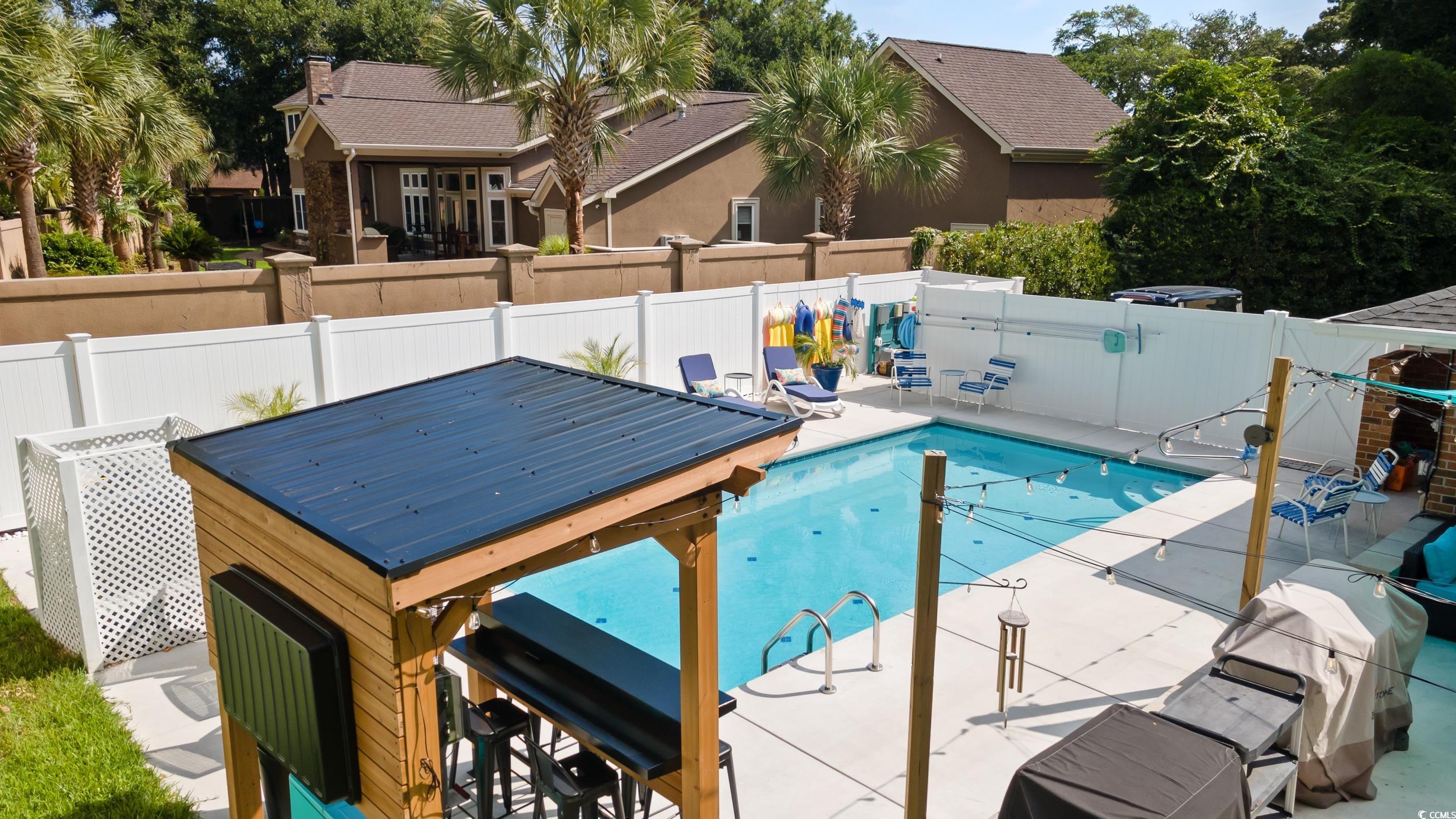 815 Tillson Road North Myrtle Beach, SC 29582 - Photo 33 of 39 View of pool featuring a fenced backyard and a patio