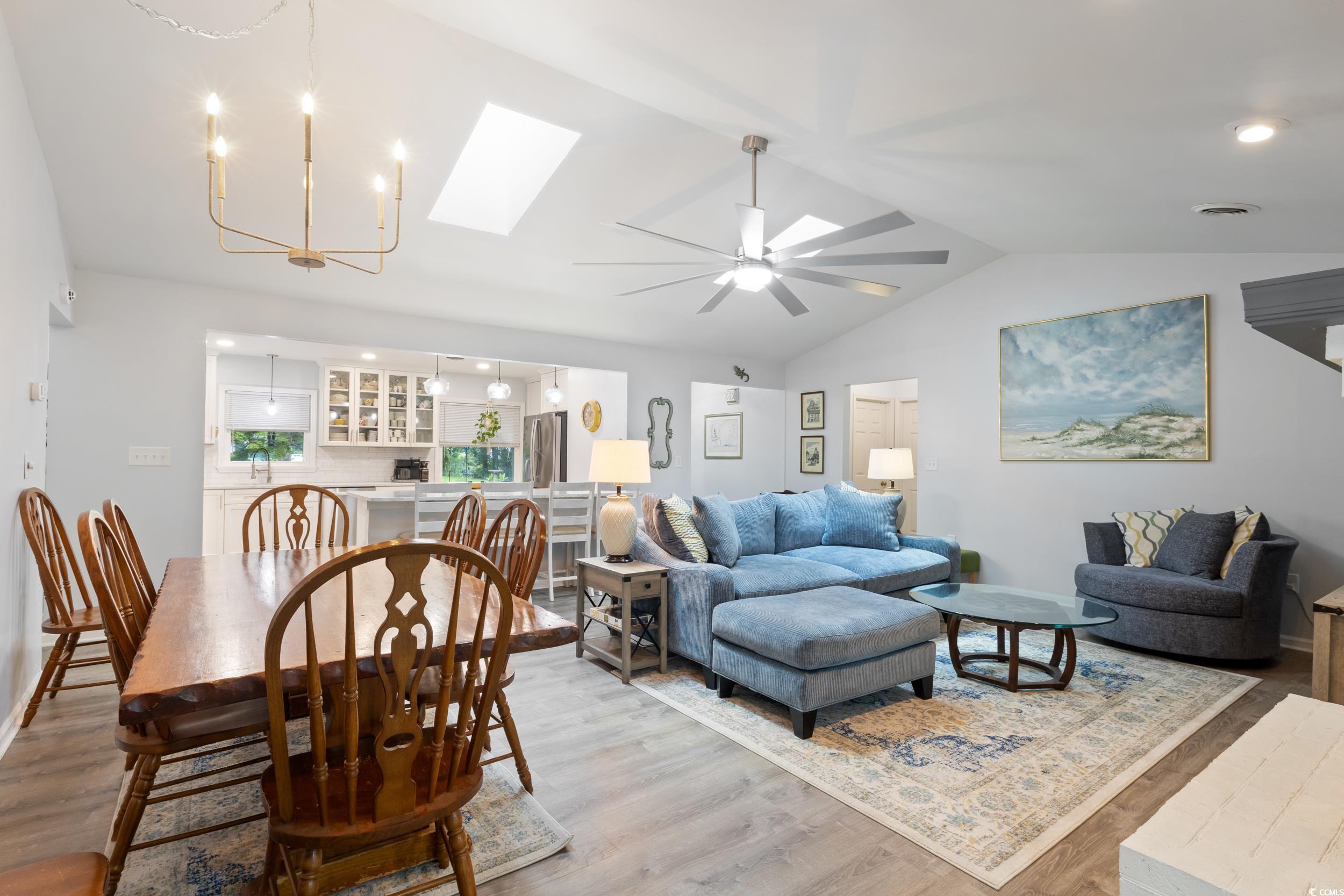 815 Tillson Road North Myrtle Beach, SC 29582 - Photo 6 of 39 Dining room with a skylight, lofted ceiling, light wood-style floors, ceiling fan, and recessed lighting