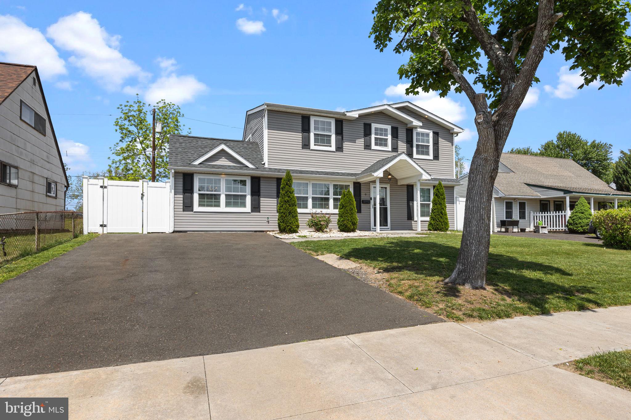 9 Verdant Road Levittown, PA 19057 - Photo 31 of 31 a front view of a house with a garden