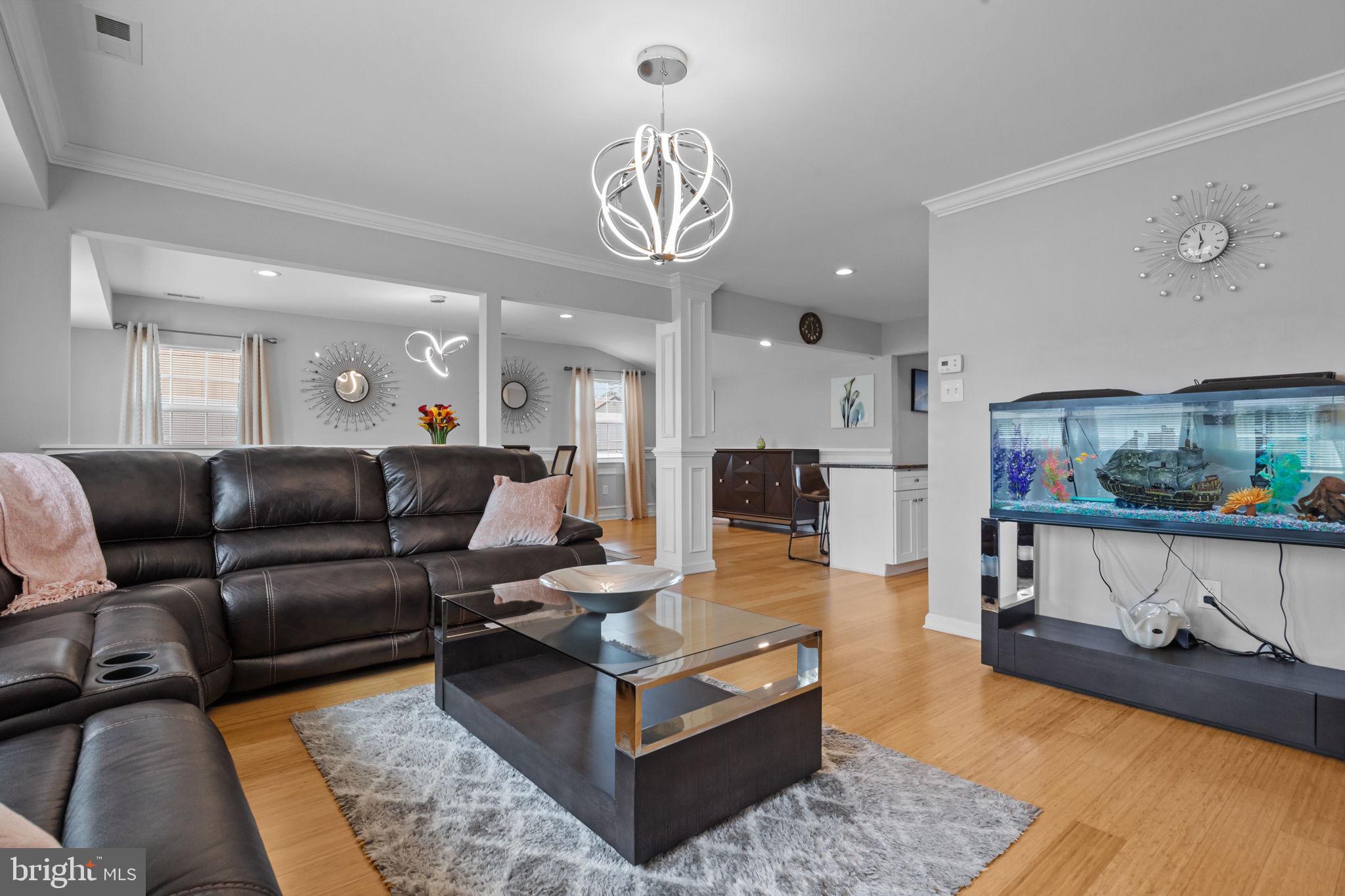 9 Verdant Road Levittown, PA 19057 - Photo 8 of 31 a living room with furniture a rug and kitchen view