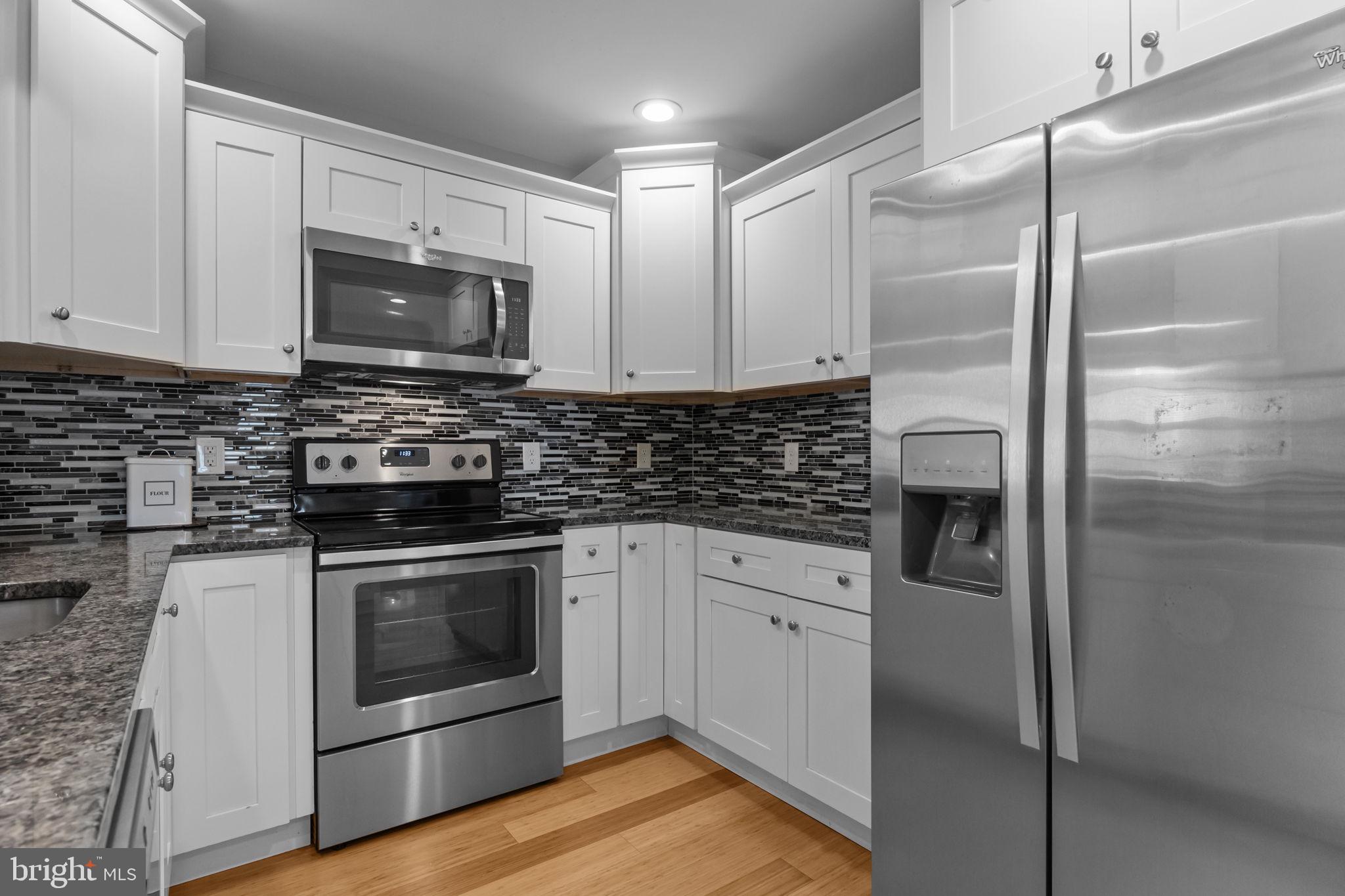 9 Verdant Road Levittown, PA 19057 - Photo 10 of 31 a kitchen with cabinets stainless steel appliances and a counter space