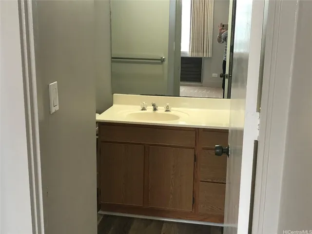 a bathroom with a sink and a mirror