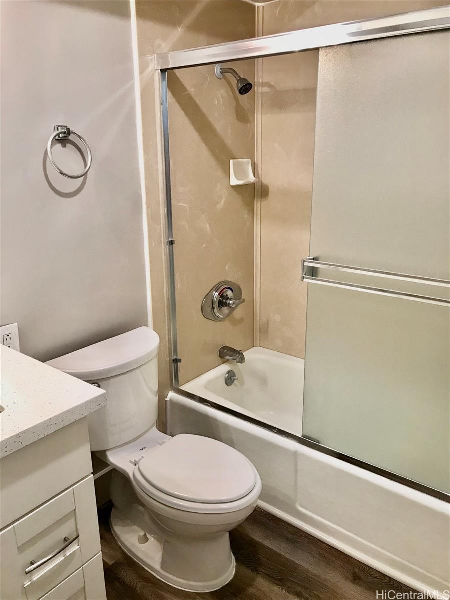1717 Ala Wai Boulevard, Unit 2502 Honolulu, HI 96815 - Photo 8 of 15 a bathroom with a toilet a sink and a shower