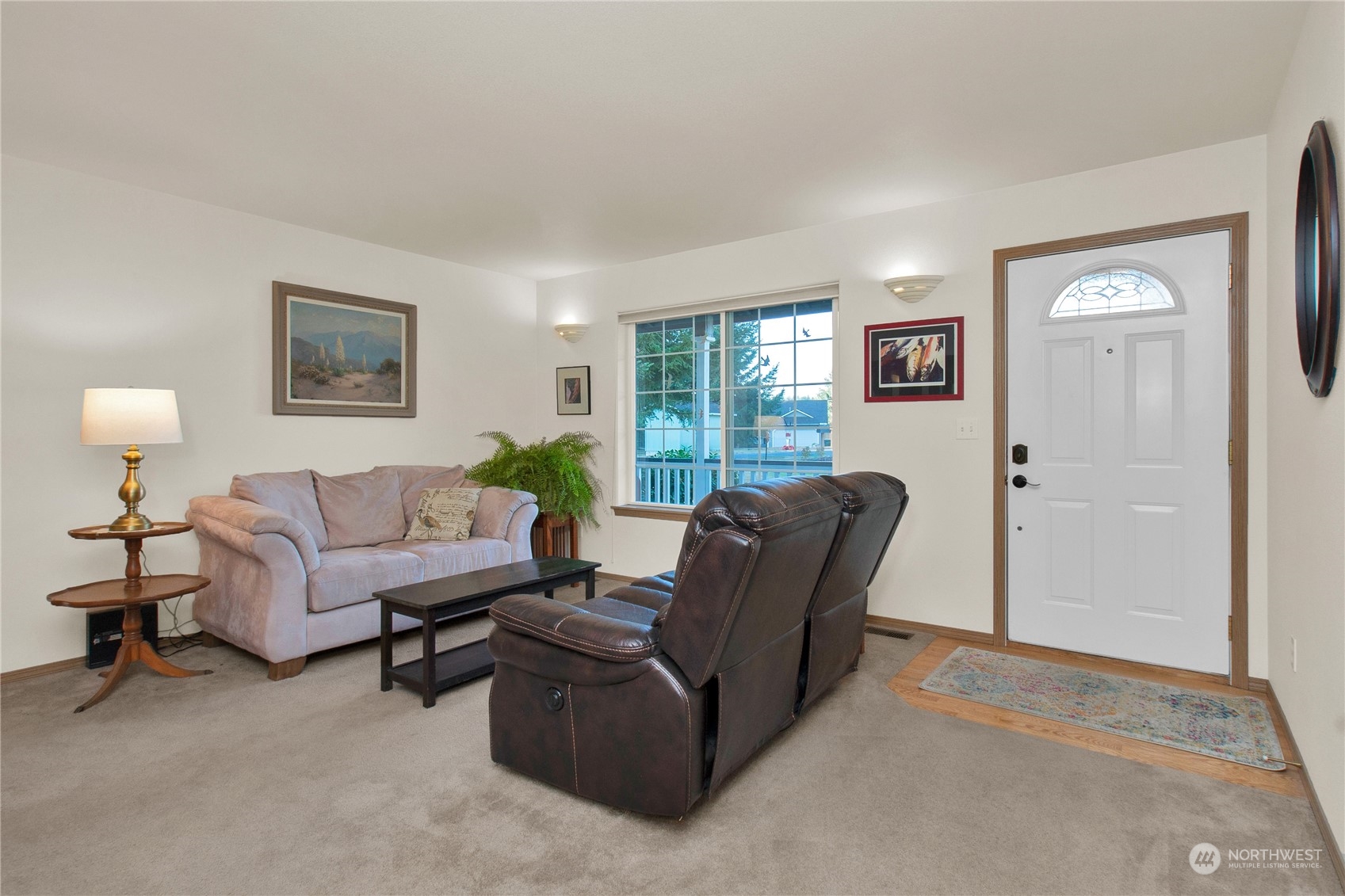 17406 Privet Court Southwest Rochester, WA 98579 - Photo 11 of 34 a living room with furniture and a window