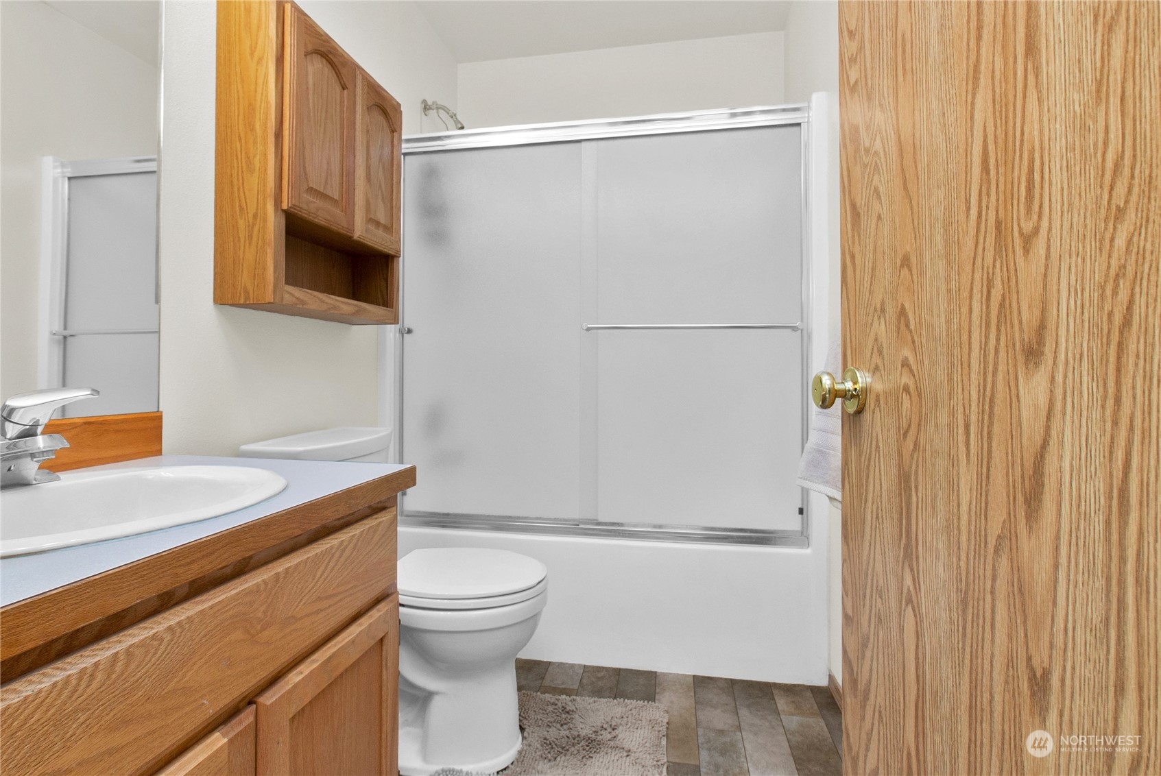 17406 Privet Court Southwest Rochester, WA 98579 - Photo 16 of 34 a bathroom with a granite countertop sink toilet and shower