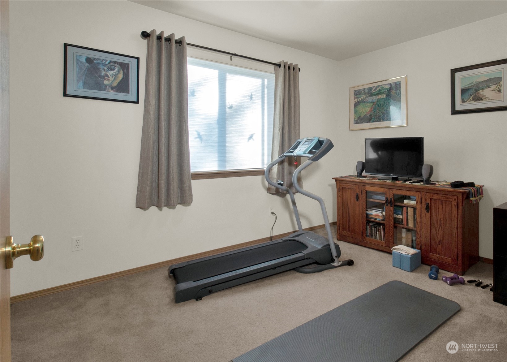 17406 Privet Court Southwest Rochester, WA 98579 - Photo 17 of 34 a room with gym equipment and a window