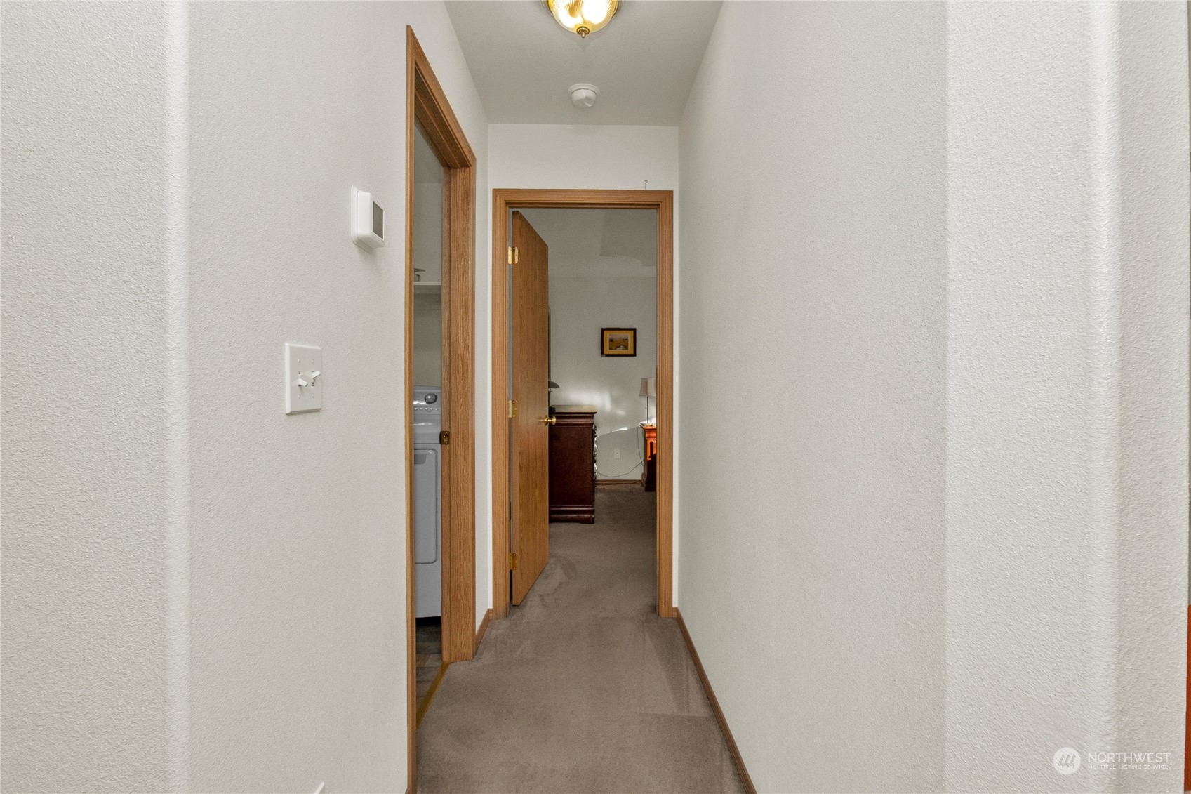 17406 Privet Court Southwest Rochester, WA 98579 - Photo 18 of 34 a view of a hallway with wooden shelves