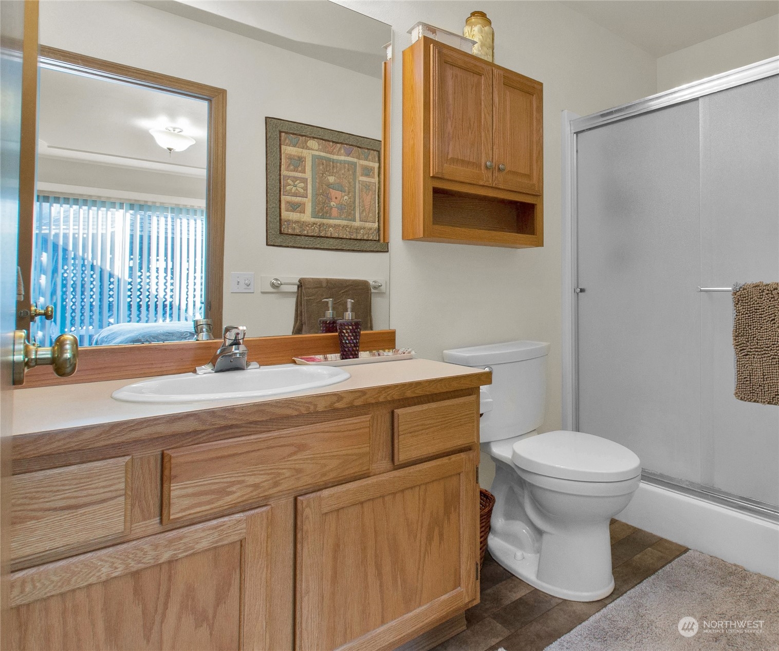 17406 Privet Court Southwest Rochester, WA 98579 - Photo 20 of 34 a bathroom with a sink a toilet and mirror
