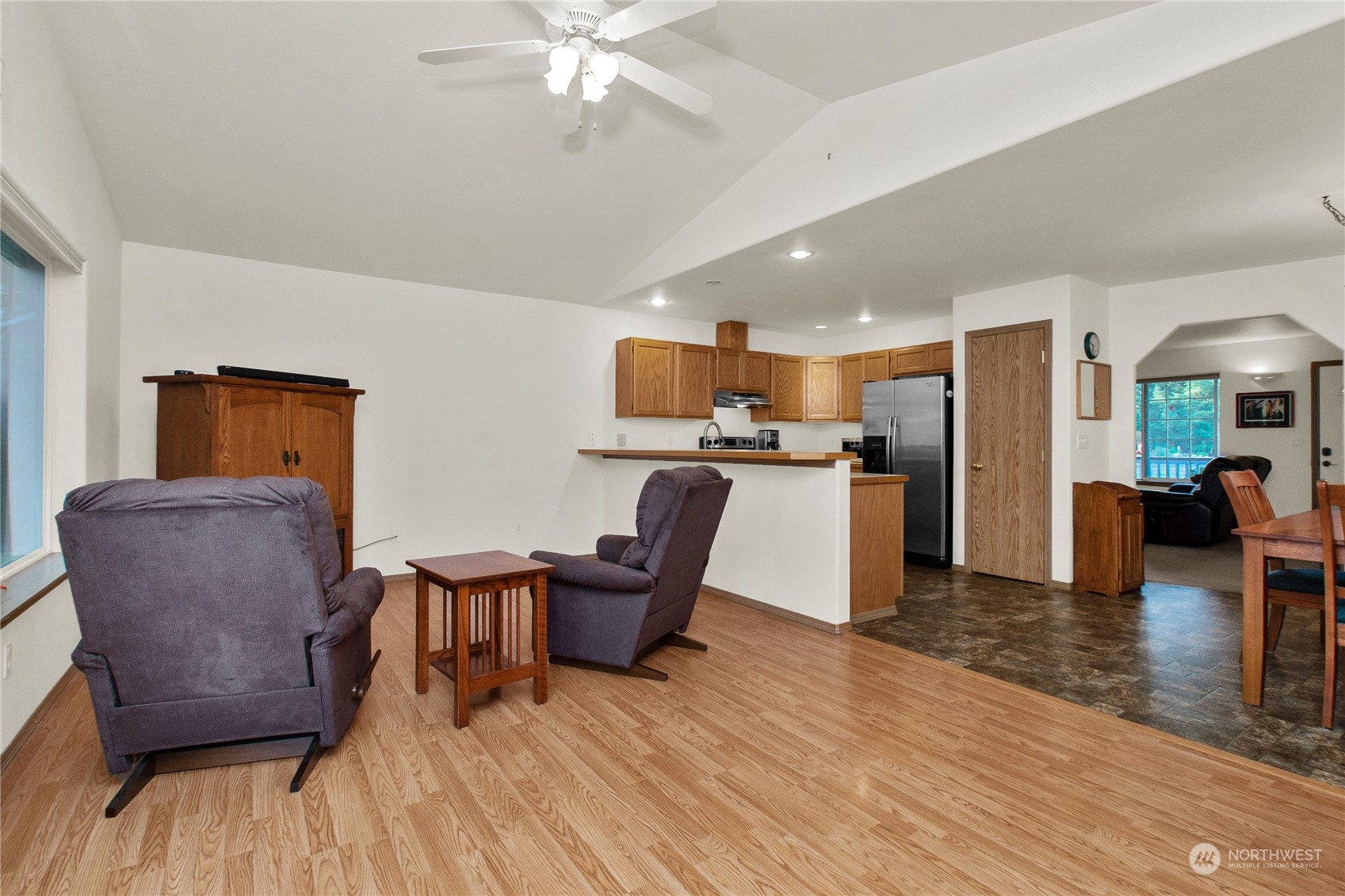17406 Privet Court Southwest Rochester, WA 98579 - Photo 27 of 34 a living room with furniture and a wooden floor