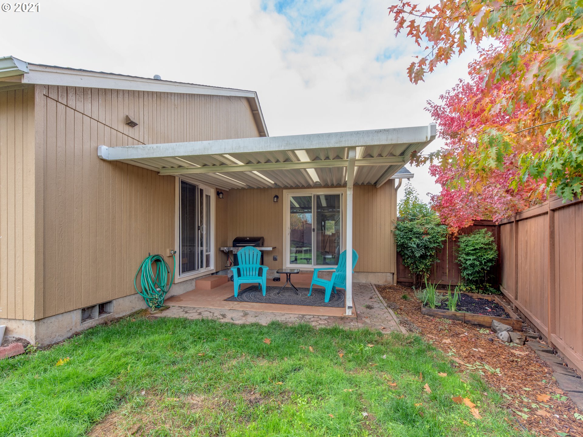 4808 Holly Street Springfield, OR 97478 - Photo 23 of 27 a view of a chair and table in backyard of the house