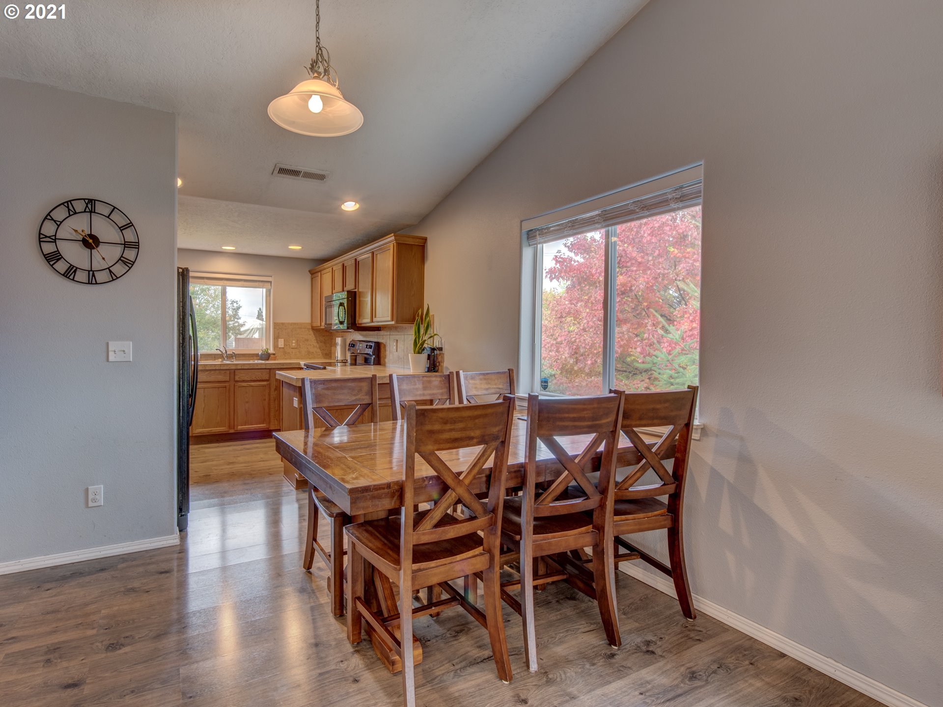 4808 Holly Street Springfield, OR 97478 - Photo 5 of 27 a view of a dining room with furniture window and wooden floor