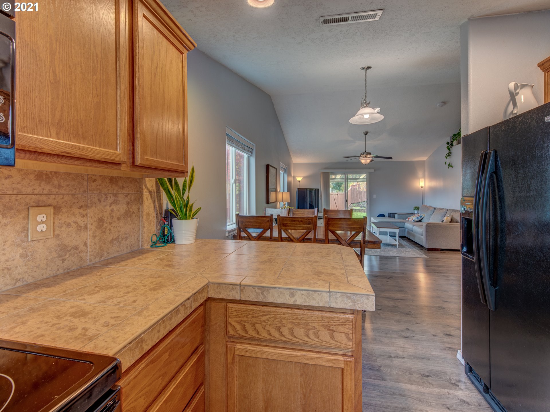 4808 Holly Street Springfield, OR 97478 - Photo 7 of 27 a kitchen with kitchen island a counter top space a sink stainless steel appliances and cabinets