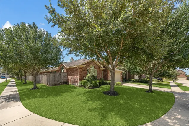 a view of a house with a small yard