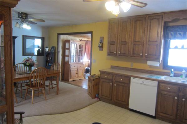 325 Mason Rd Extension Dudley, MA 01571 - Photo 12 of 30 a kitchen with cabinets and chairs