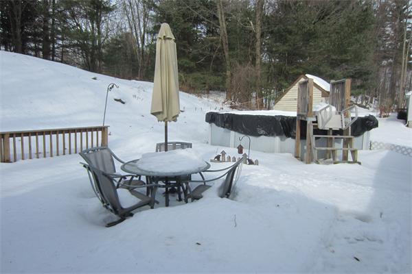 325 Mason Rd Extension Dudley, MA 01571 - Photo 16 of 30 a view of a patio with a table and chairs