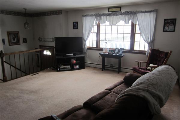 325 Mason Rd Extension Dudley, MA 01571 - Photo 5 of 30 a living room with furniture and a flat screen tv