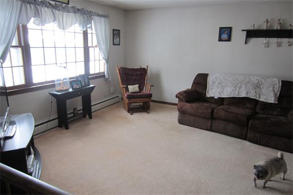 325 Mason Rd Extension Dudley, MA 01571 - Photo 6 of 30 a living room with furniture and a large window