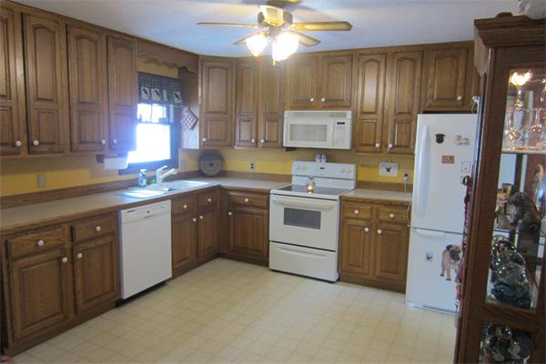 325 Mason Rd Extension Dudley, MA 01571 - Photo 9 of 30 a kitchen with a sink cabinets and window