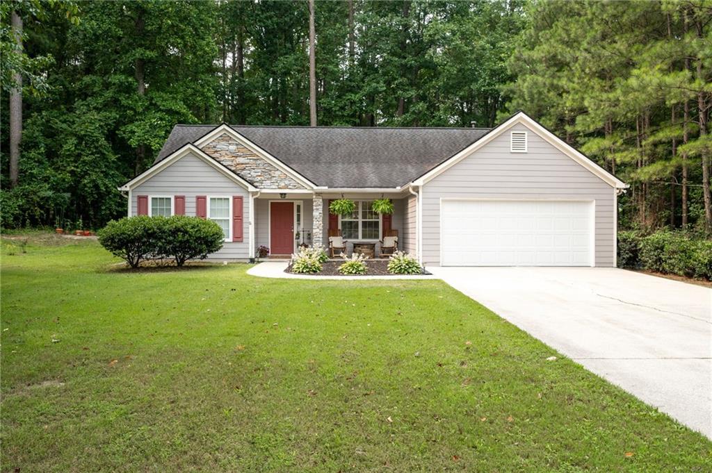2501 Autumn Run Court Southwest Powder Springs, GA 30127 - Photo 1 of 1 a front view of house with yard and green space