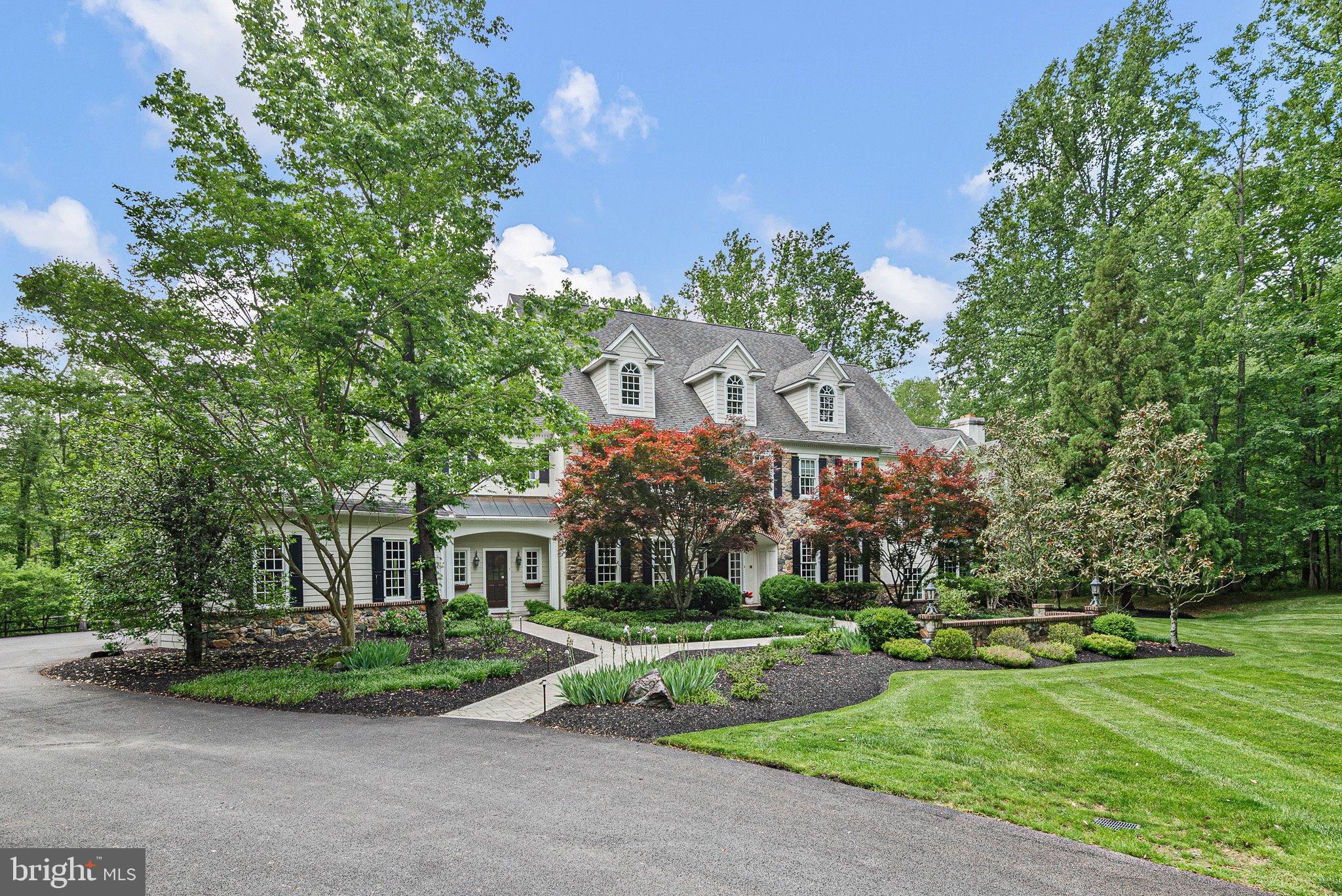 104 Timber Ridge Lane Chadds Ford, PA 19317 - Photo 4 of 65 a front view of a house with a yard