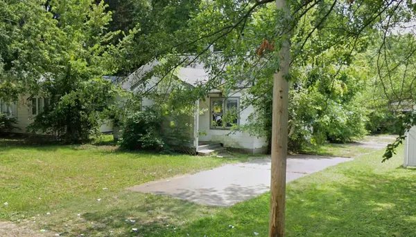 a backyard of a house with lots of green space