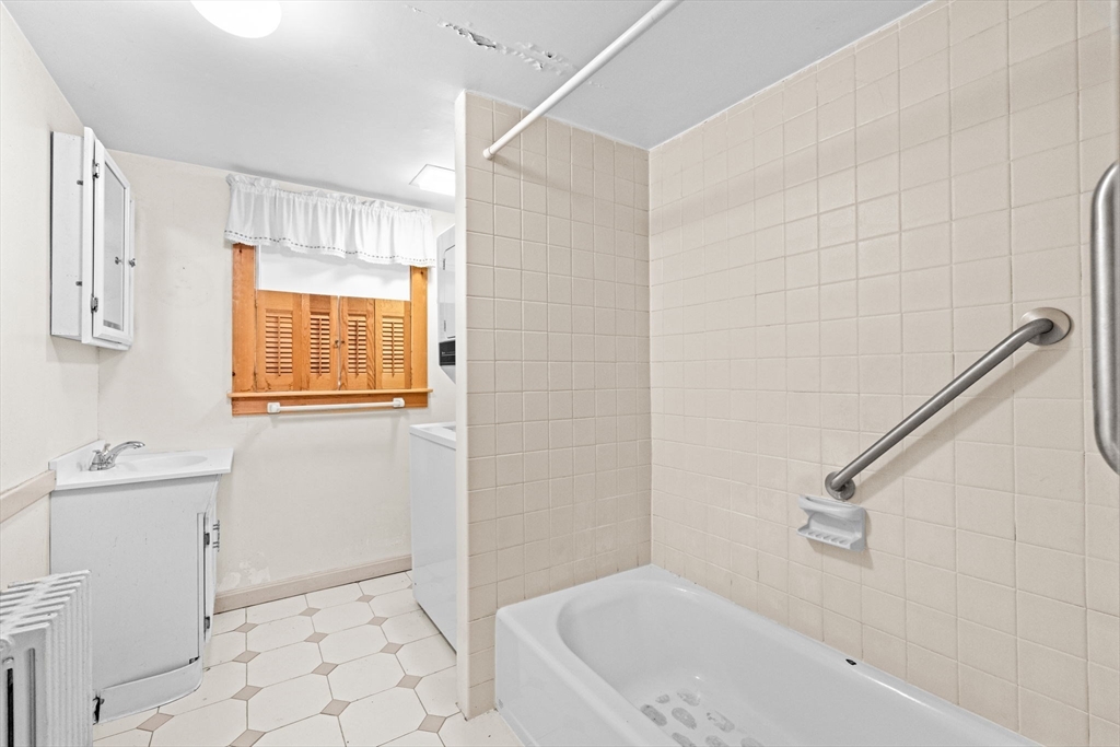 89 Ripley Road Cohasset, MA 02025 - Photo 12 of 23 a bathroom with a sink a toilet and shower