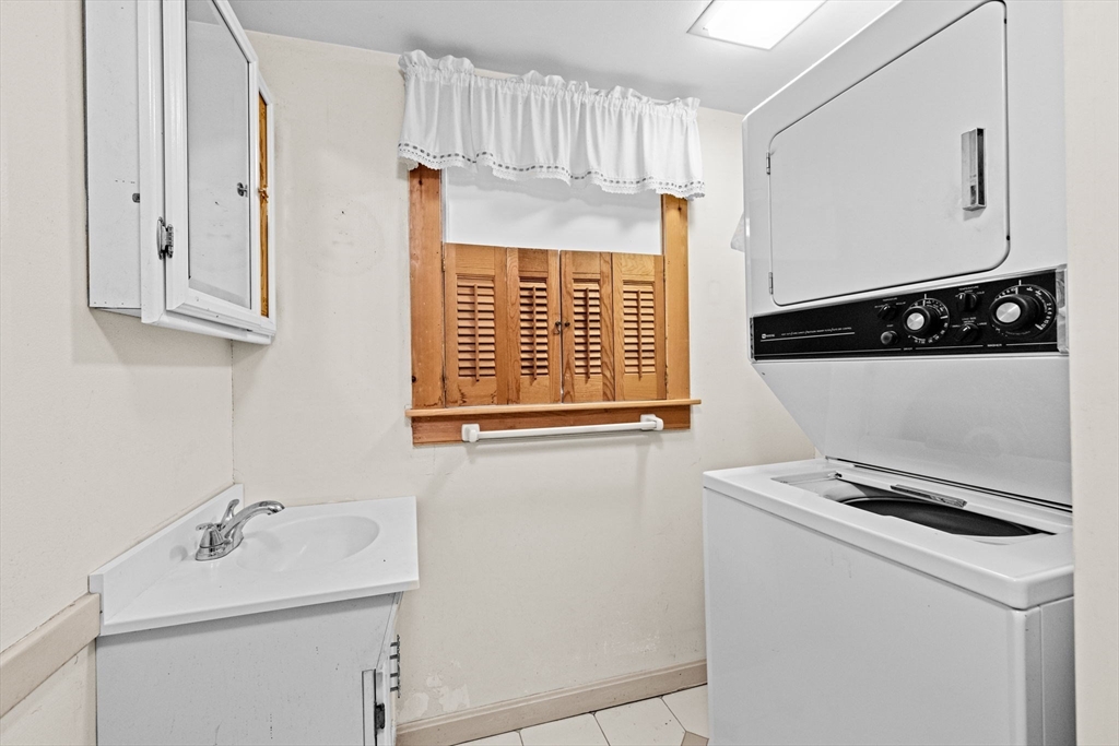89 Ripley Road Cohasset, MA 02025 - Photo 13 of 23 a bathroom with a sink and a window