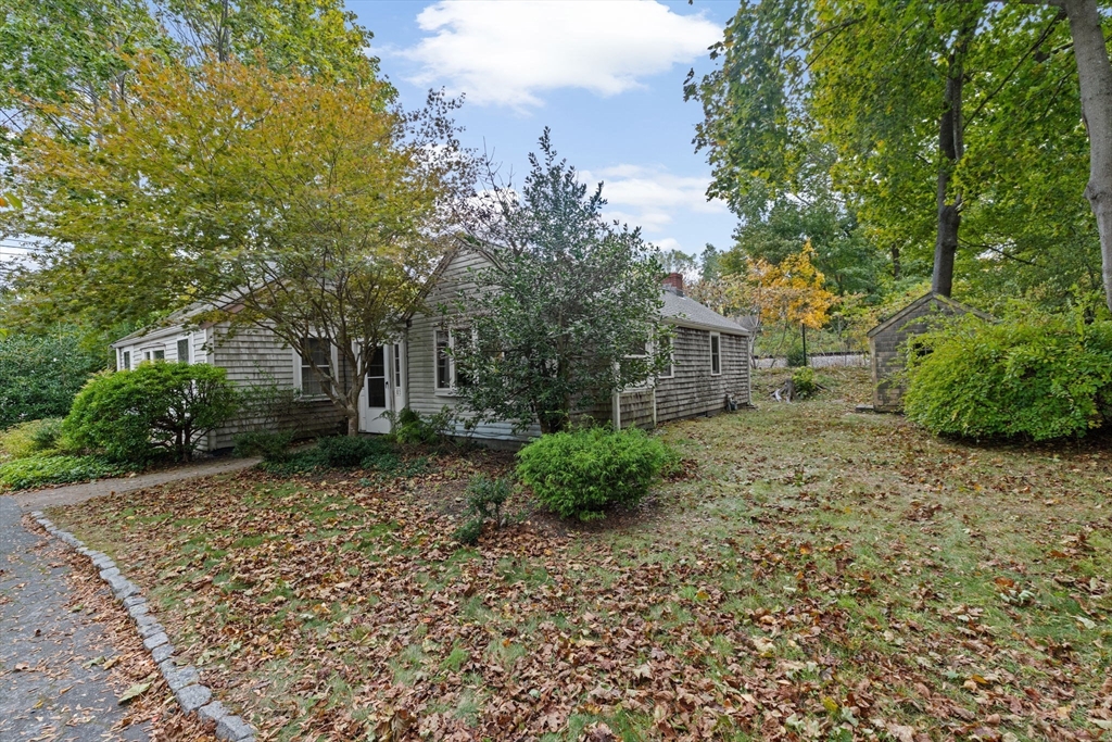 89 Ripley Road Cohasset, MA 02025 - Photo 17 of 23 a view of a house with a yard