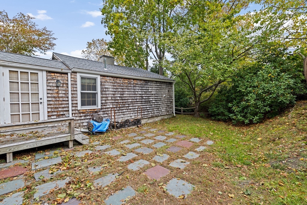 89 Ripley Road Cohasset, MA 02025 - Photo 18 of 23 a view of a backyard with a large tree