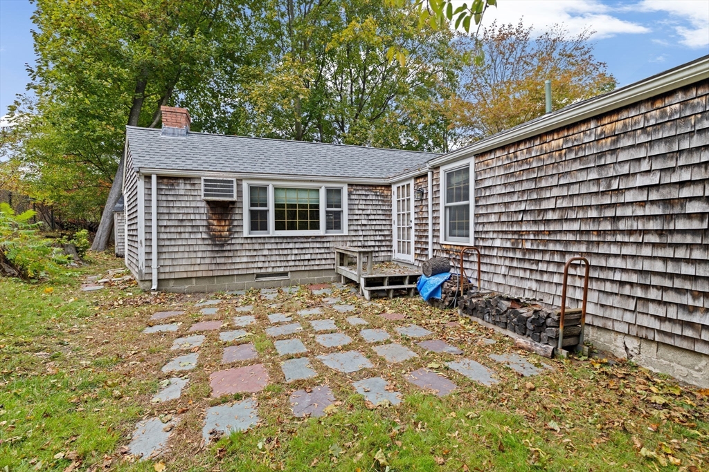 89 Ripley Road Cohasset, MA 02025 - Photo 19 of 23 a backyard of a house with table and chairs