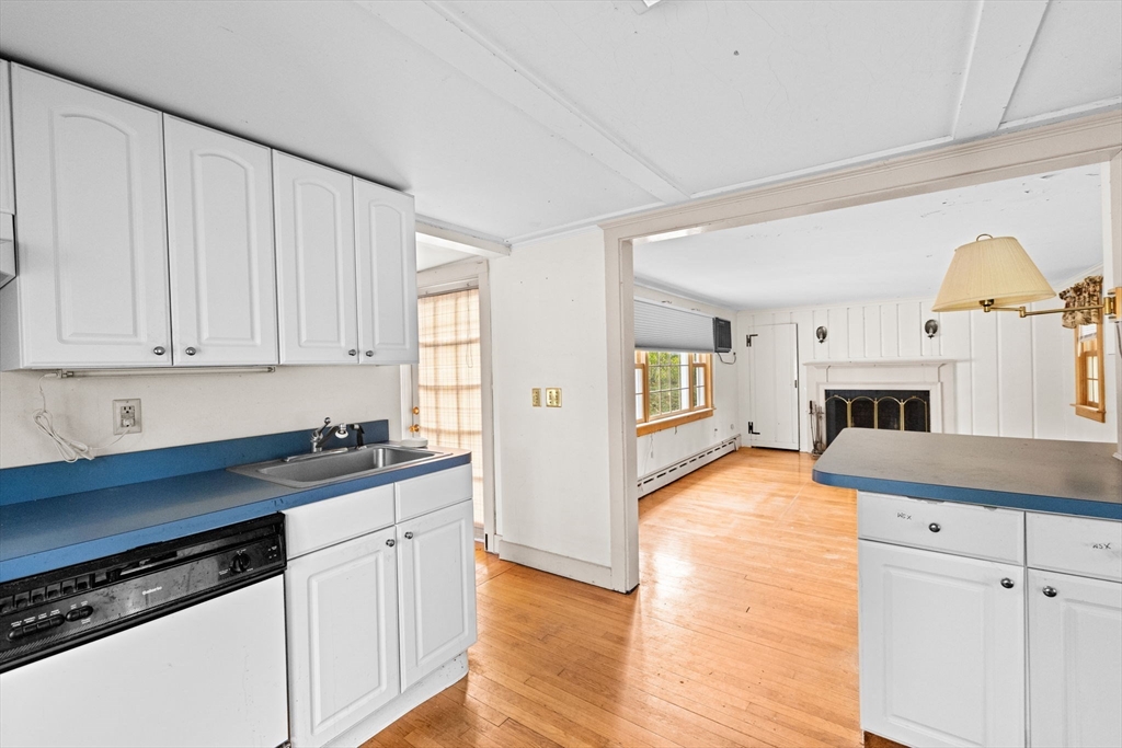 89 Ripley Road Cohasset, MA 02025 - Photo 4 of 23 a kitchen with sink cabinets and window