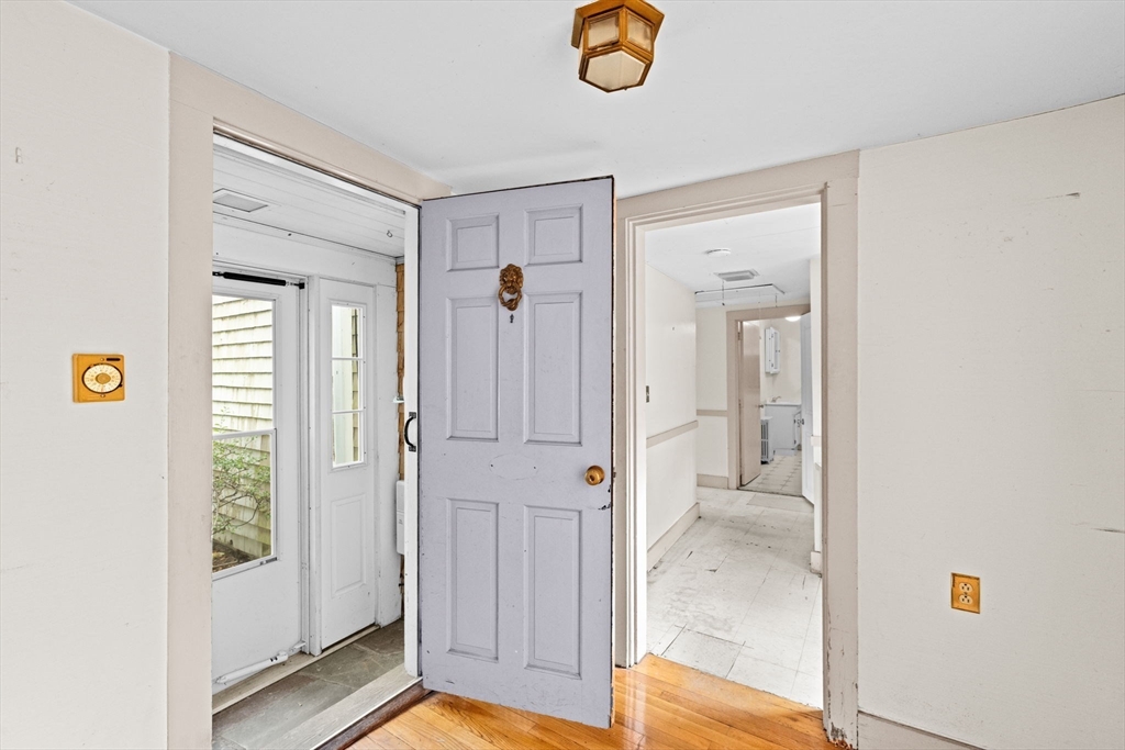 89 Ripley Road Cohasset, MA 02025 - Photo 7 of 23 a view of a bathroom with a shower a sink and a mirror