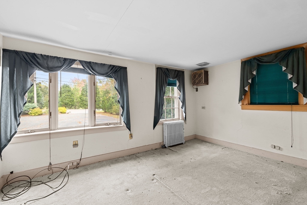 89 Ripley Road Cohasset, MA 02025 - Photo 8 of 23 a view of an empty room with a window