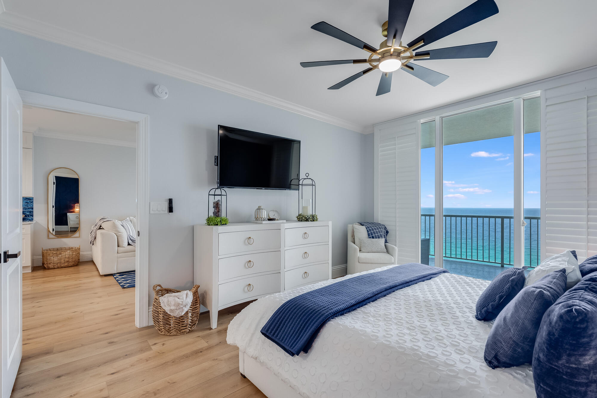 17281 Front Beach Road, Unit 802 Panama City Beach, FL 32413 - Photo 20 of 57 a bedroom with a bed and a flat screen tv