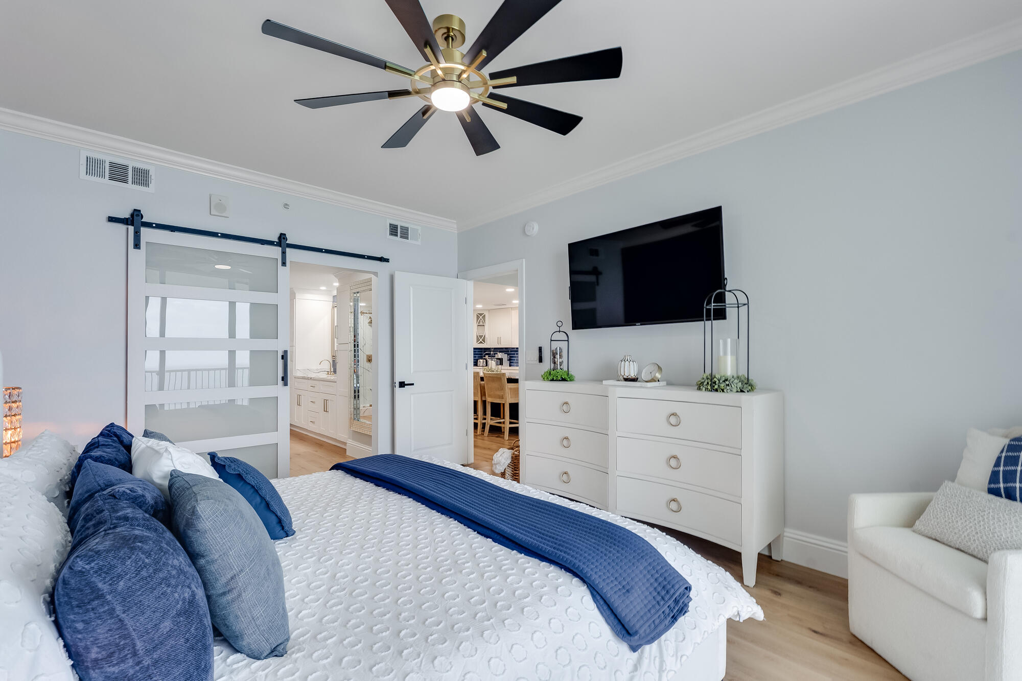 17281 Front Beach Road, Unit 802 Panama City Beach, FL 32413 - Photo 21 of 57 a bedroom with a large bed and a flat screen tv