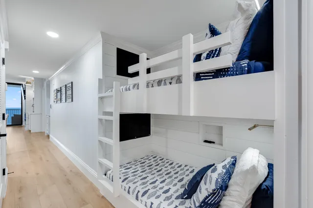 a bedroom with a bed and a night stand