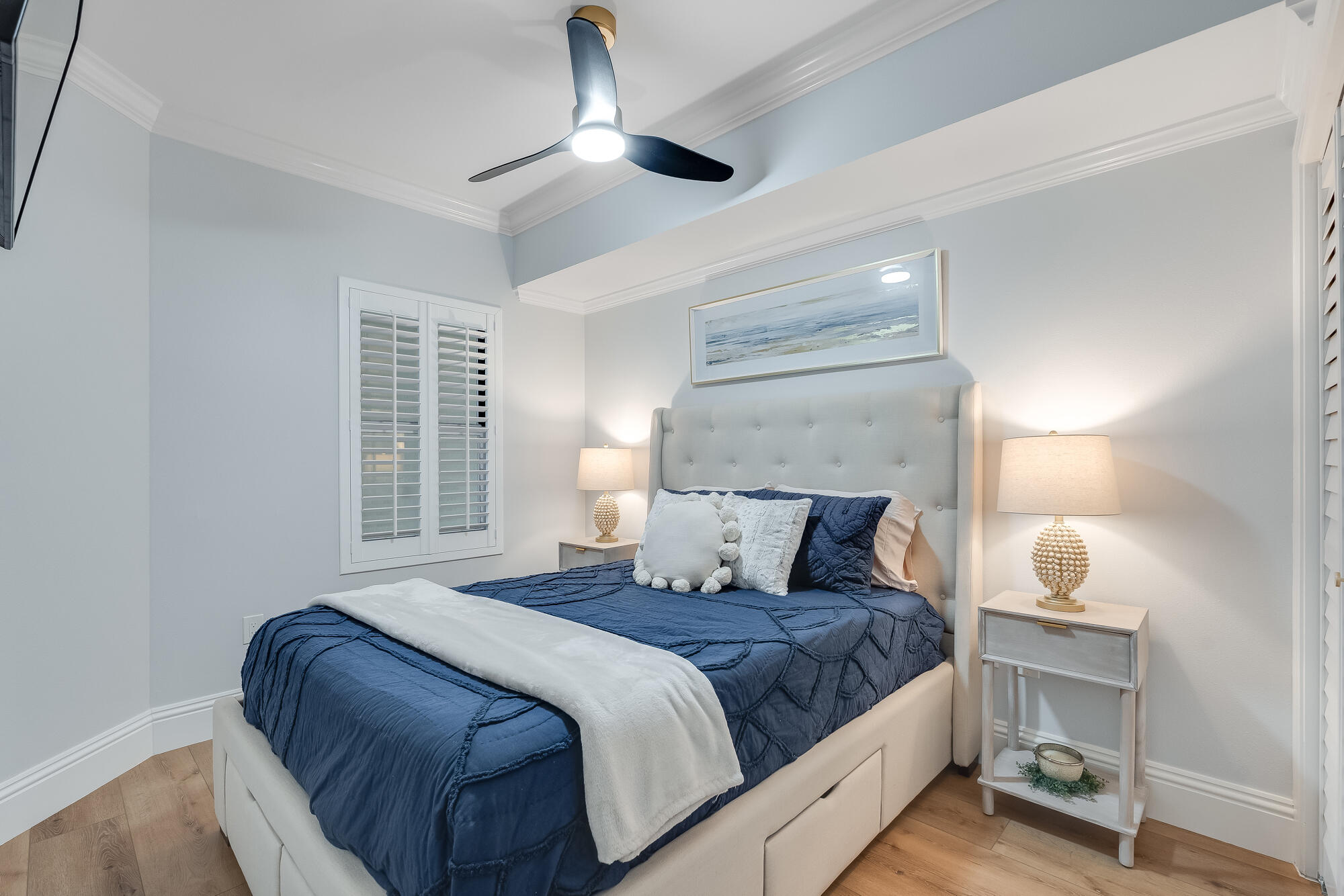 17281 Front Beach Road, Unit 802 Panama City Beach, FL 32413 - Photo 35 of 57 a bedroom with a bed and a night stand