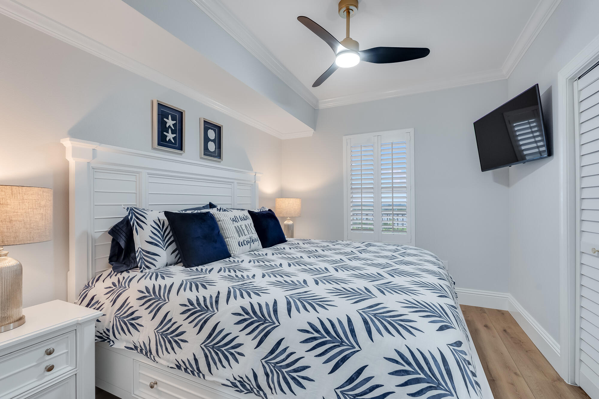 17281 Front Beach Road, Unit 802 Panama City Beach, FL 32413 - Photo 38 of 57 a bedroom with a large bed and a tv