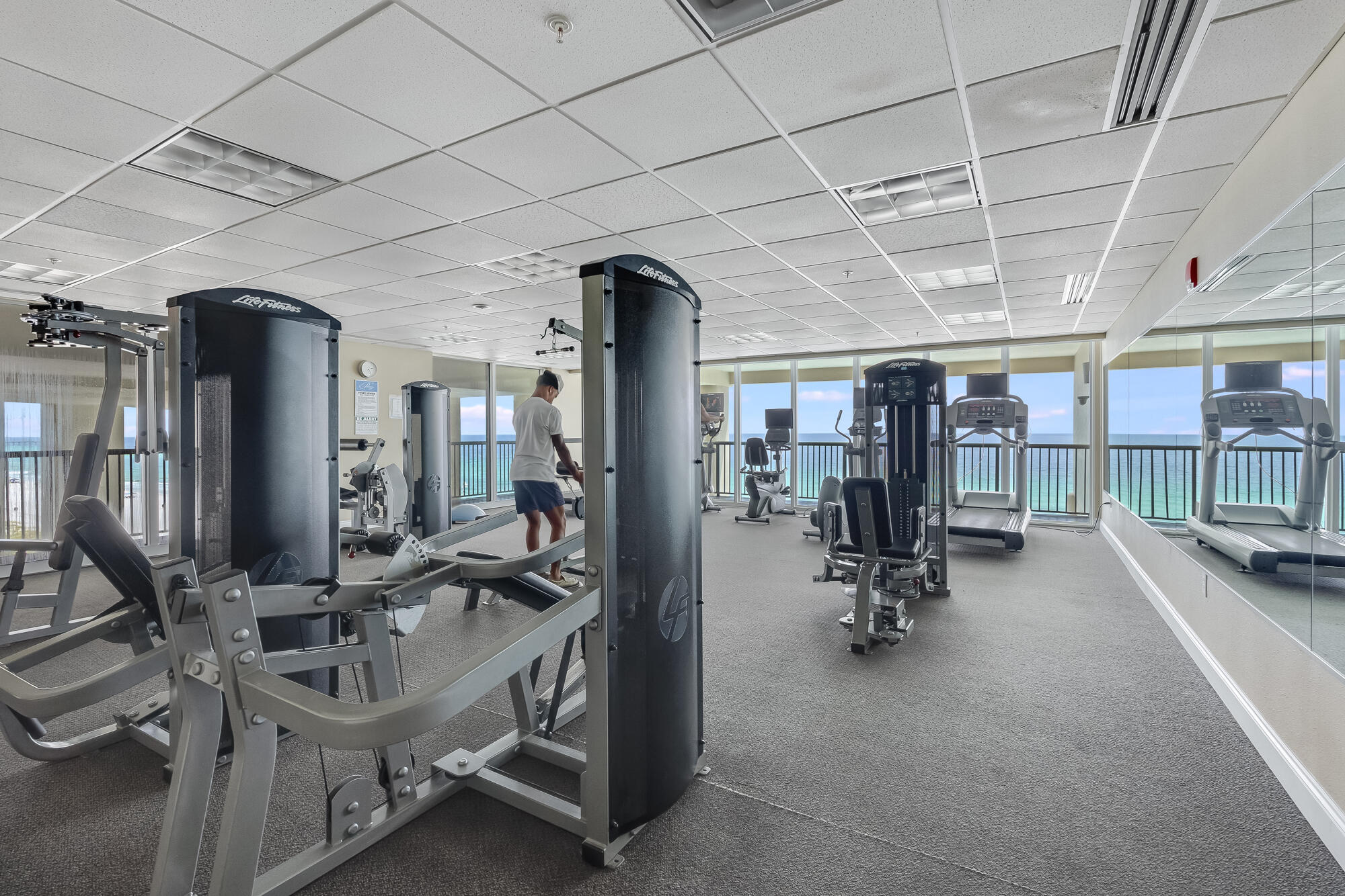 17281 Front Beach Road, Unit 802 Panama City Beach, FL 32413 - Photo 55 of 57 a view of a room with gym equipment