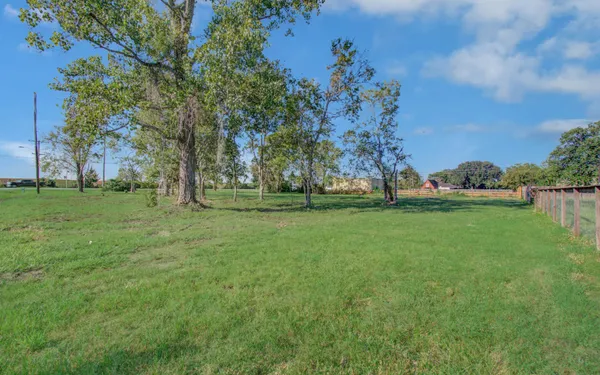 a view of outdoor space with trees all around