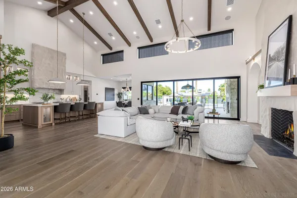 a kitchen with kitchen island white cabinets and stainless steel appliances