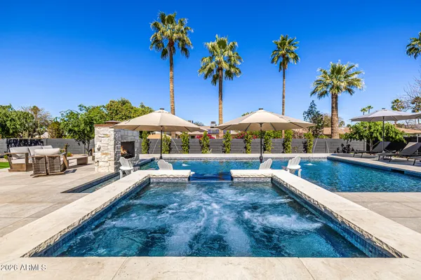 a spacious bedroom with a large bed and a window