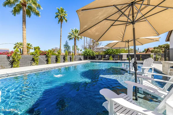 a view of a kitchen with a dishwasher and white cabinets