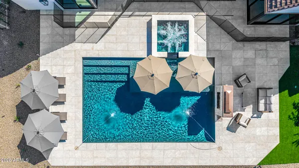 a bedroom with a large bed and a dresser