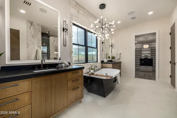a view of a livingroom with a fireplace and window