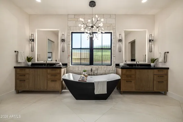 a kitchen with stainless steel appliances kitchen island granite countertop a table and chairs in it